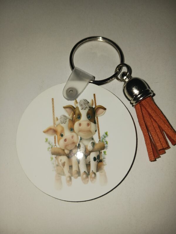 Round Cows Keychain With Brown Tassel